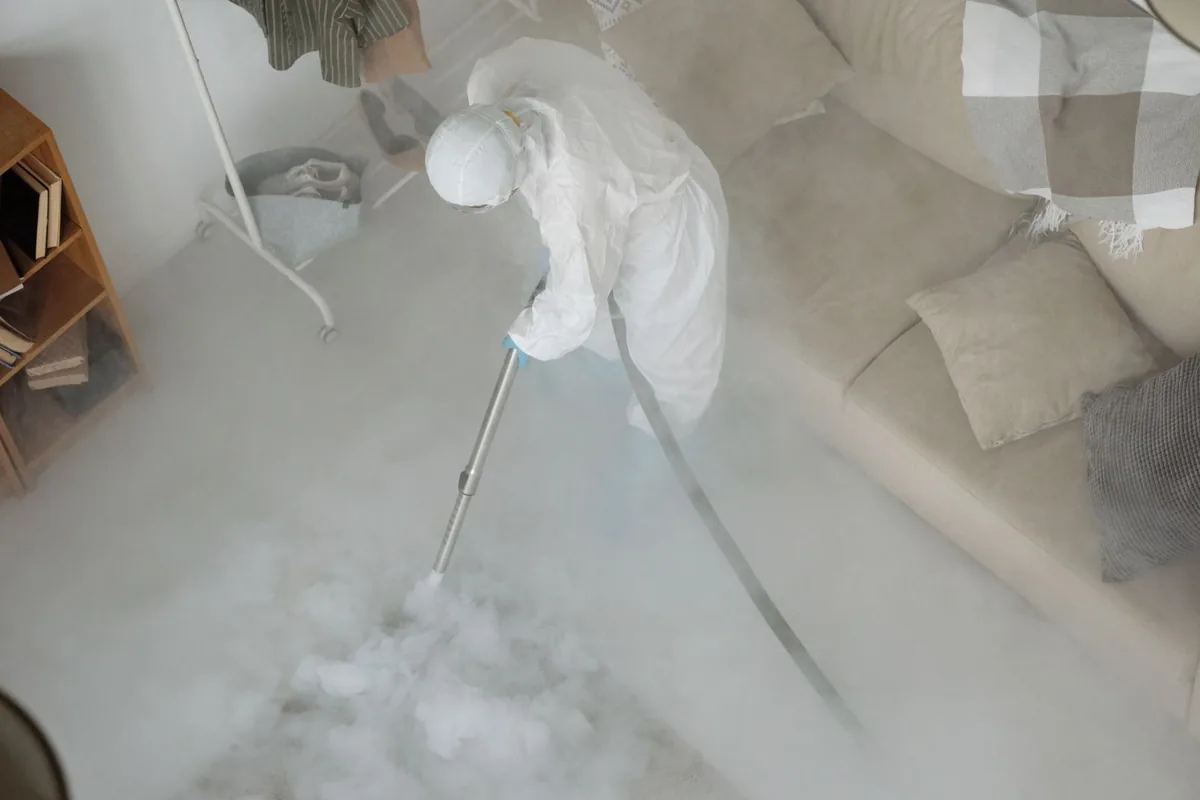 Biohazard cleanup technician in protective equipment, Thompson's Station, TN
